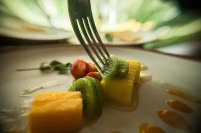 a fork sitting on top of a plate of food at Las Casitas del Arco Iris in Urubamba