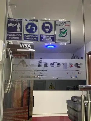 a bunch of signs on the wall of a restaurant at A-Hope Suite Hotel in Huancayo