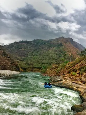 a group of people in a raft in a river at Eco Quechua Lodge in Santa Teresa