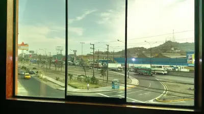 a view from a window of a highway with traffic at Hostal Residencial Mochica in Lima