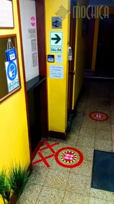 a yellow machine on the floor of a building at Hostal Residencial Mochica in Lima