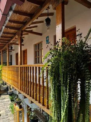a porch of a house with lots of plants at Huascaran Casa Boutique San Blas in Cusco