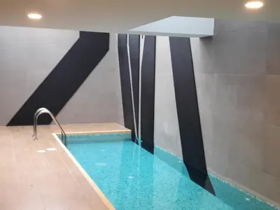 a swimming pool in a building with a swimming pool at Miraflores Heart Apartment in Lima