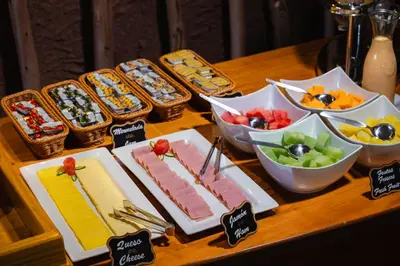 a table topped with plates of food and bowls of fruit at Hacienda del Valle Sagrado in Urubamba