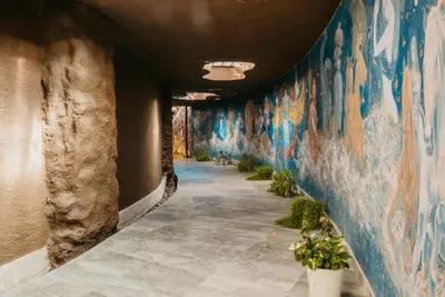 a hallway with graffiti on the walls of a building at Hacienda del Valle Sagrado in Urubamba