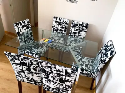 a glass table with two chairs and a glass table at Condominio Uptown de 2 dormitorios in Lima