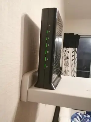 a black router sitting on top of a shelf at Condominio Uptown de 2 dormitorios in Lima