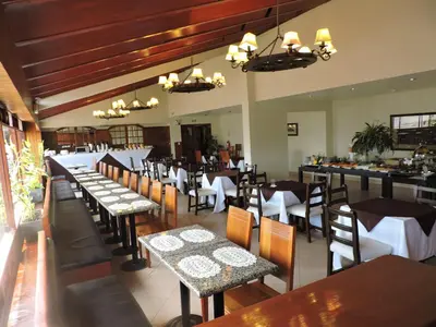 a dining room with tables and chairs and tablesearcher at Epiqus Hotel in Lima