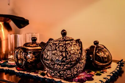 two tea pots sitting on top of a table at Cooper Hotel Boutique in Cusco