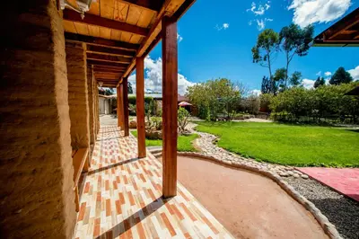 an open porch of a house with a grass yard at Alojamiento Casa Yanantin de Maravilca in Concepción