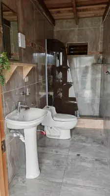 a bathroom with a sink and a toilet at Alojamiento Casa Yanantin de Maravilca in Concepción