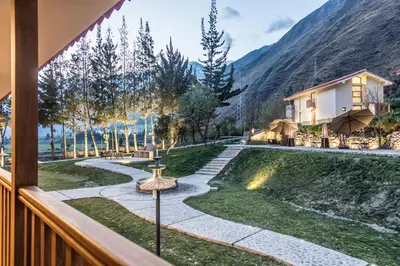 a view from the balcony of a house with a garden at Del Pilar Ollantaytambo in Ollantaytambo