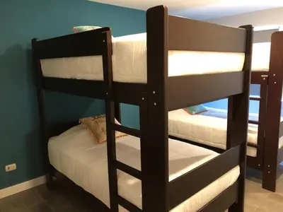 a couple of bunk beds in a room at MLA apartments - 28 de Julio in Lima