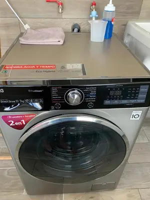 a washing machine with a counter on top of it at MLA apartments - 28 de Julio in Lima