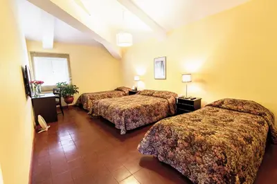 a hotel room with two beds in a room at LP Express Hotel Tarma in Tarma