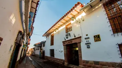 an alley with buildings in an old town at Hostal El Grial in Cusco