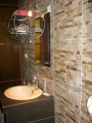a bathroom with a sink and a mirror at apartamentos Los cedros in Lima
