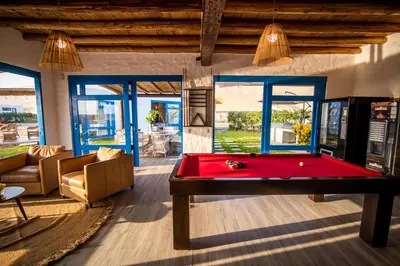 a living room with a red pool table at Topara Hotel Boutique in San Vicente de Cañete