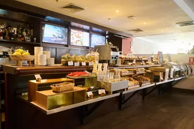 a buffet line with food on display in a restaurant at Casa Andina Select Miraflores in Lima