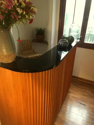 a counter with a vase with flowers in a room at Belma Boutique Bed and Breakfast in Lima