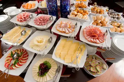 a table topped with lots of plates of food at Radisson Hotel Decapolis Miraflores in Lima