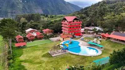 an aerial view of a resort with a water park at Fundo Hassinger in Oxapampa