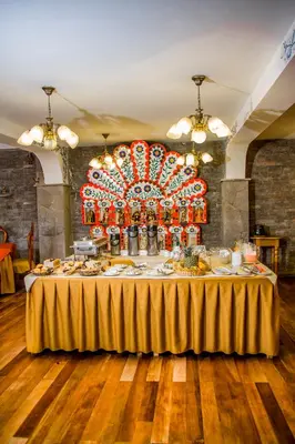 a table with food on it in a room at Hotel Warari in Cusco