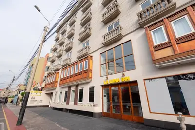 a building on the side of a street at La Luna Inn in Lima