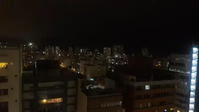 a view of a city at night with lights at MIRAFLORES LUXURY PLACE POOL GYM 2BD in Lima