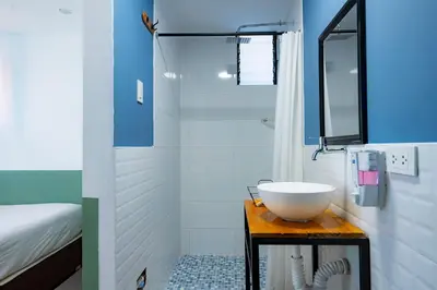 a bathroom with a sink on a wooden table at Casa Samaykuy in Ayacucho