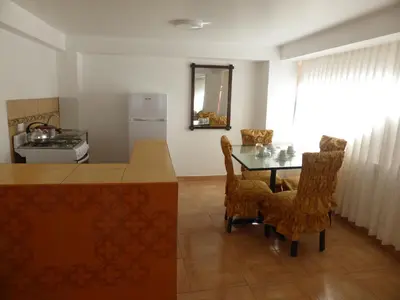 a kitchen with a table and chairs in a room at Apartment Samana House in Cusco