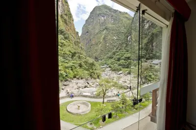 a window with a view of a mountain at Tierra Viva Machu Picchu Hotel in Machu Picchu