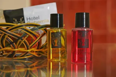 two bottles of essential oils sitting on a table at Hotel Bohemia in Lima