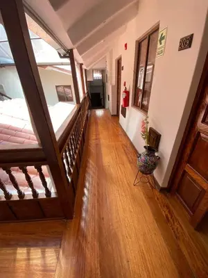 a hallway with a stairway leading to a room at Cusco Hotel Boutique in Cusco