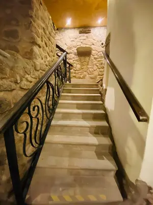 a stairway in a castle with a stone wall at Cusco Hotel Boutique in Cusco