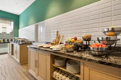 a kitchen with a buffet of food on a counter at Holiday Inn Express - Lima San Isidro by IHG in Lima
