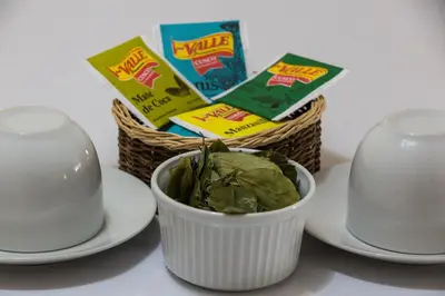 a basket of chips and a bowl of spinach at Askha Cusco in Cusco