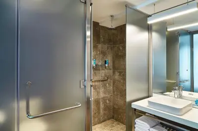 a bathroom with a shower and a sink at Aloft Lima Miraflores in Lima