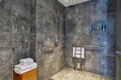 a bathroom with a shower and a toilet at Aloft Lima Miraflores in Lima