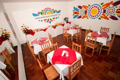 an overhead view of a restaurant with tables and chairs at Cusco Plaza Nazarenas in Cusco