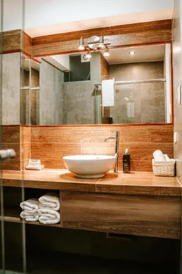 a bathroom with a sink and a mirror at Muru Homely Hotel Cusco in Cusco