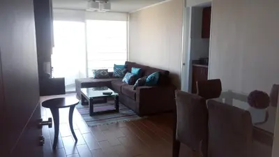 a living room with a couch and a table at Lima Flats in Lima