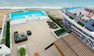 an overhead view of a building with a swimming pool at Lima Flats in Lima
