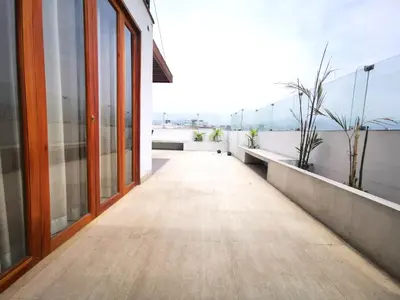 an empty corridor of a building with windows at Residencial Cafferata in Lima