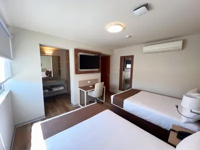 a hotel room with a bed and a desk at DM Hoteles Nasca in Nazca