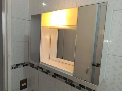 a bathroom with a mirror and a sink at Room 5 Star Miraflores in Lima
