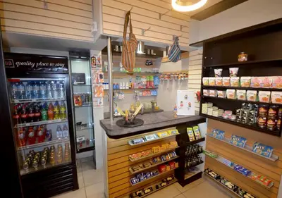 a grocery store with a drink counter in a store at qp Hotels Lima in Lima