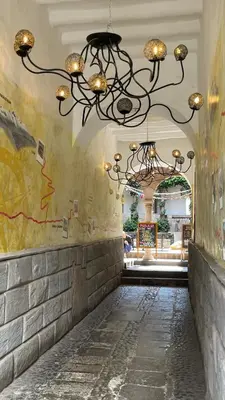 a chandelier hanging from the ceiling in a building at Pariwana Hostel Cusco in Cusco