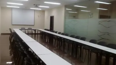 a lecture room with chairs and a white board at Hotel Candamo in Lima