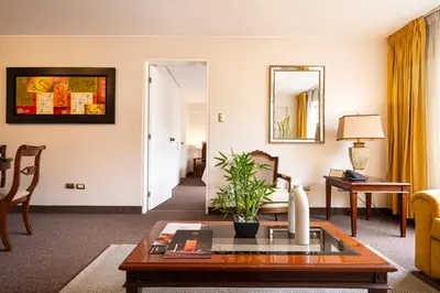 a living room with a couch and a table at Apart Hotel San Martin in Lima